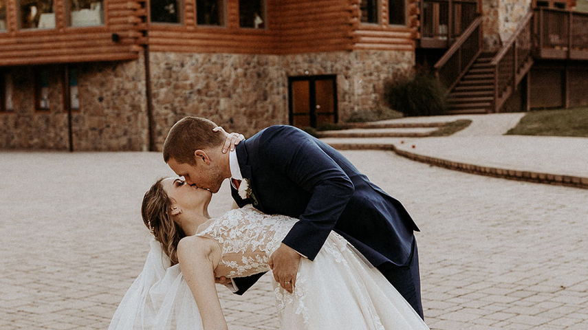 Bride and Groom Outside of Boulder Ridge Lodge at Liberty