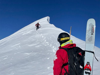 Ski Patrollers Ascend Mountain at Crested Butte