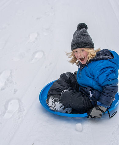 Young Boy Sledding at Stevens Pass