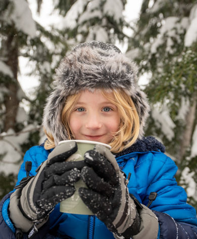 Boy Enjoying Hot Cocoa Outdoors at Stevens Pass