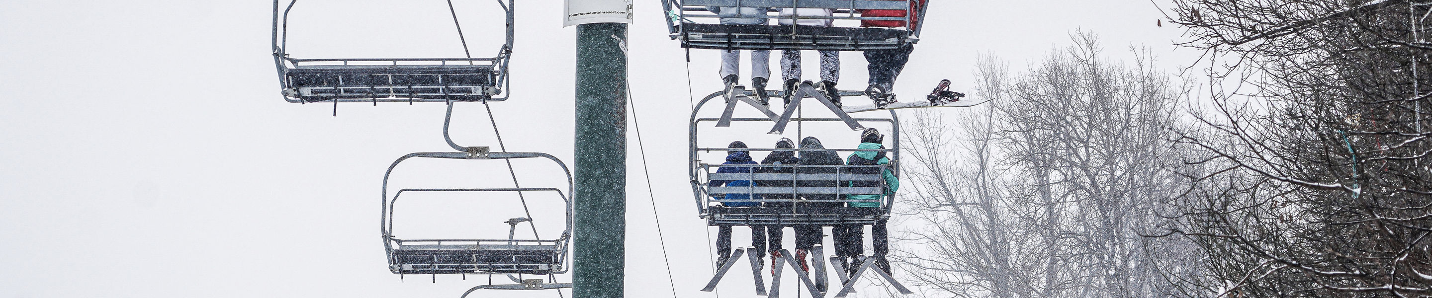 Resort Guests Riding Chairlift at Roundtop