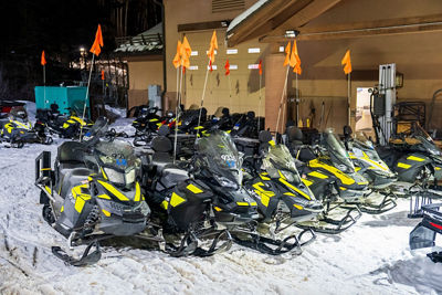 Snow Mobiles Lined Up Outside of Lodge at Beaver Creek