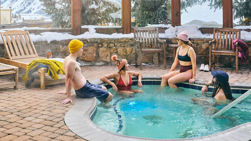 Friend Group Relaxes in Hot Tub at Crested Butte