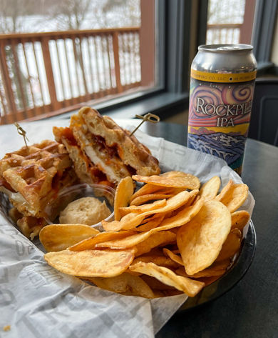 Chicken and Waffle Sandwich with a Beer at Wildcat Pub