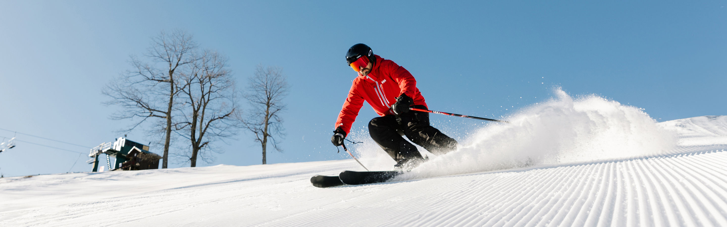 Man Skis on Corduroy Snow Down Mountain at Seven Springs