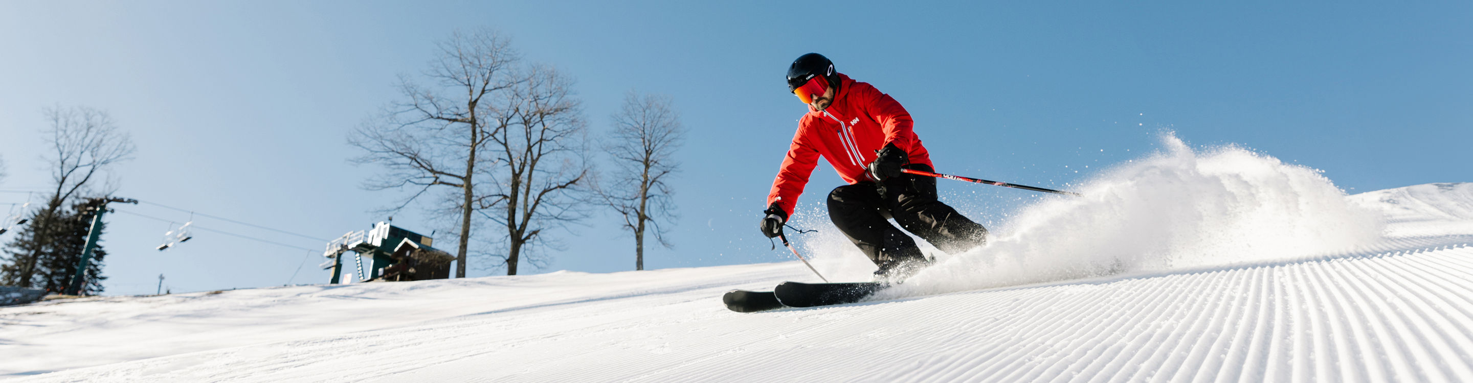 Man Skis on Corduroy Snow Down Mountain at Seven Springs