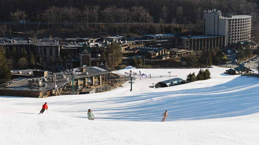 Friends Ski Down Mountain at Seven Springs