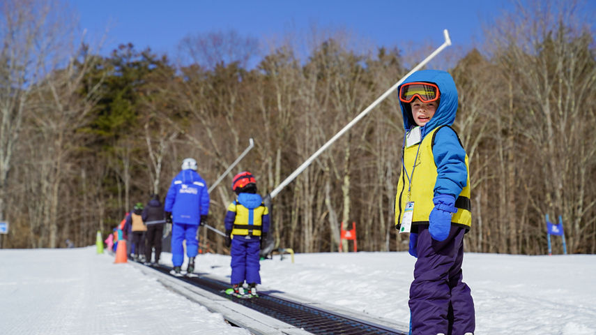 Child on Magic Carpet Lift at Mount Sunapee Ski Ride School