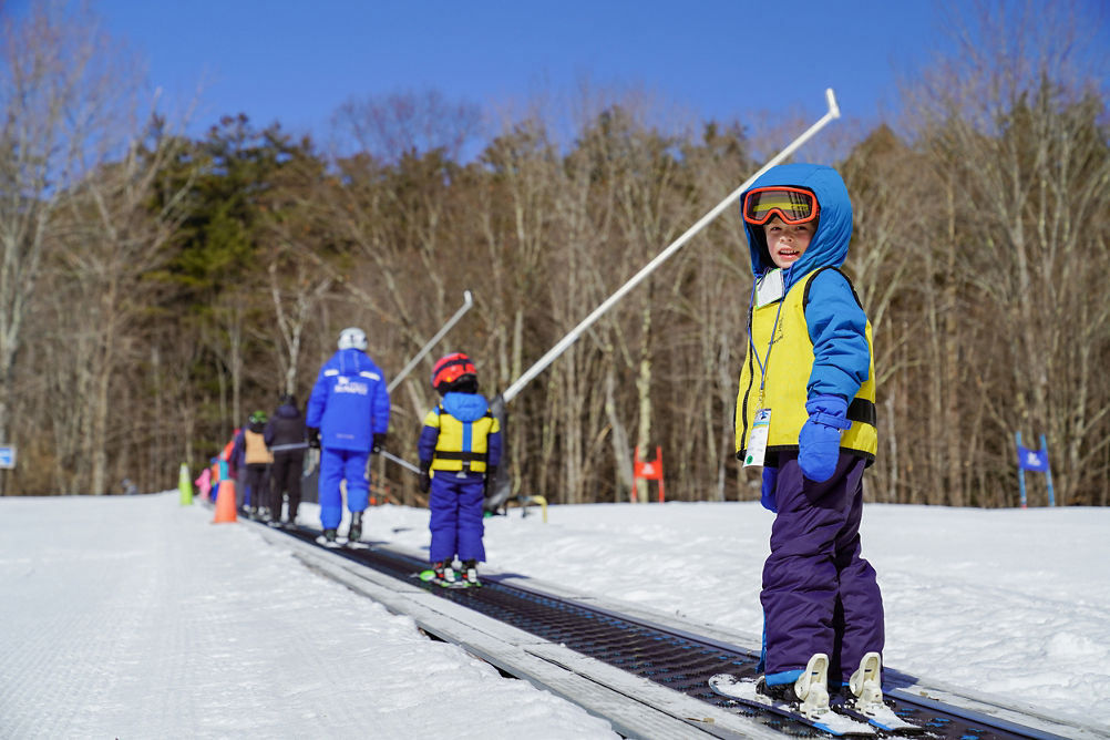 Child on Magic Carpet Lift at Mount Sunapee Ski Ride School