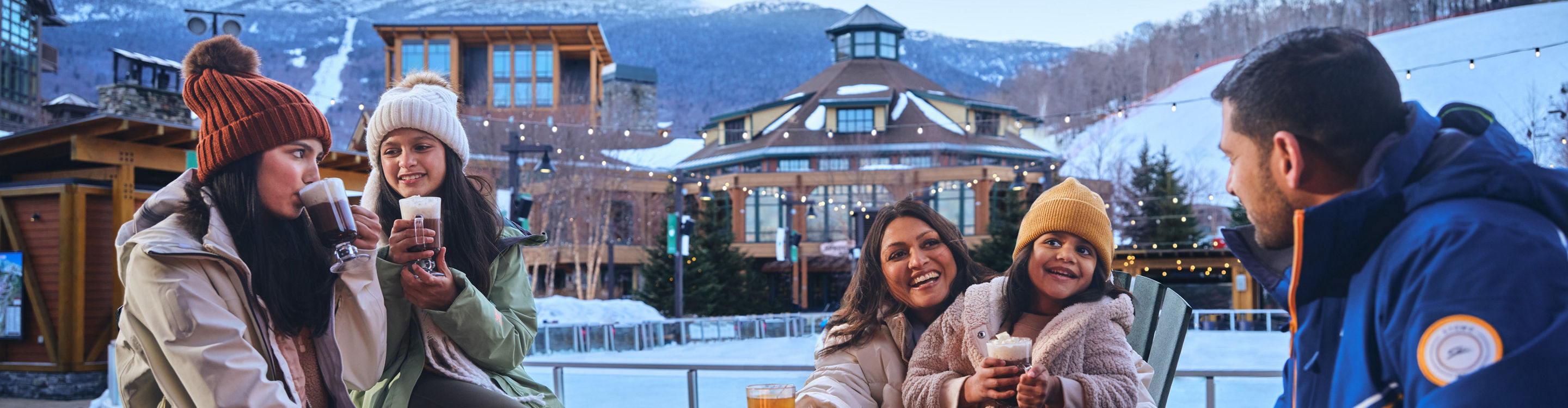 Family Around Firepit at Ice Skating Rink at Stowe