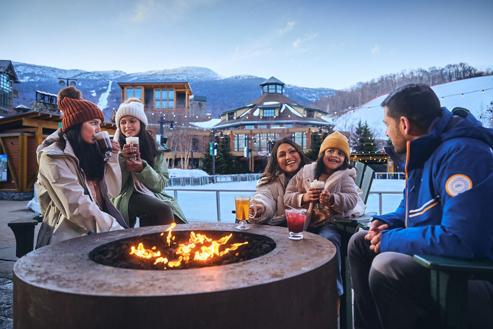 Family Around Firepit at Ice Skating Rink at Stowe