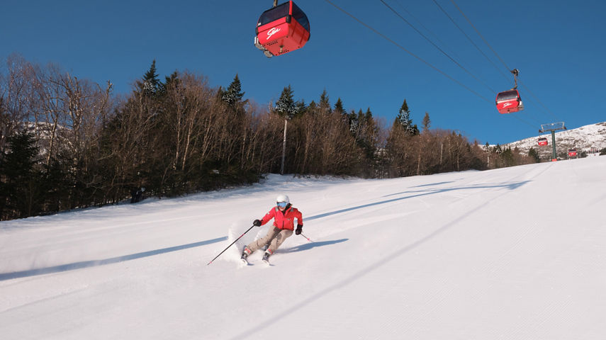 Woman Skiing Down Mountain at Stowe