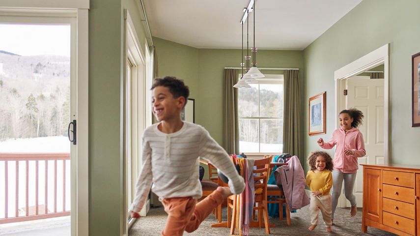 Siblings Run Around Lodge at Okemo