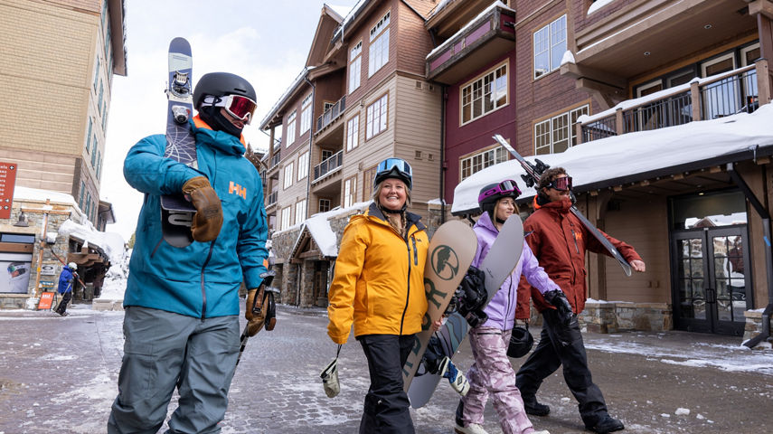 Friends Walk Around Northstar Base and Village Area with Ski Gear