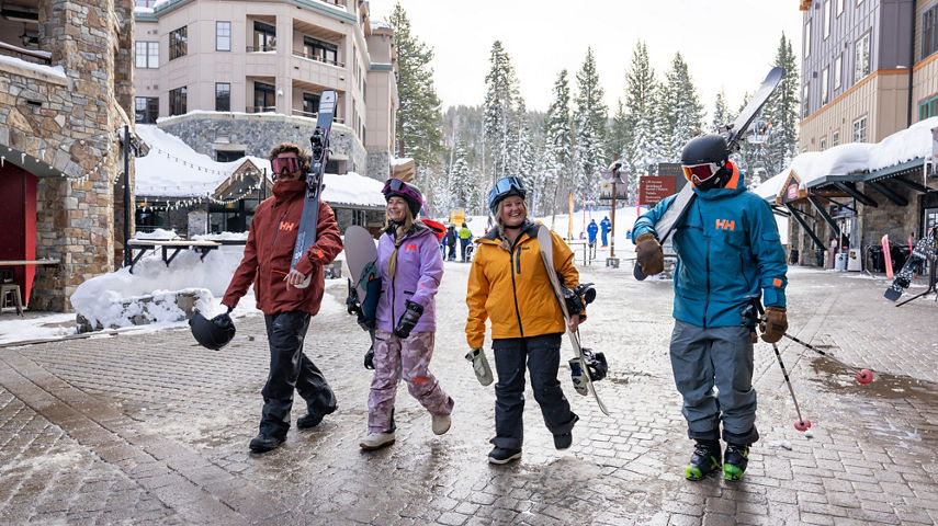 Friends Walk Around Northstar Base and Village Area with Ski Gear