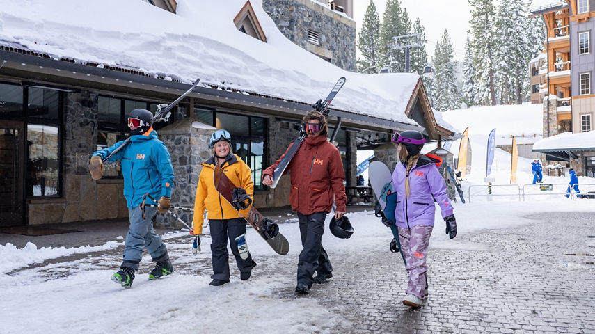 Friends Walk Around Northstar Base and Village Area with Ski Gear