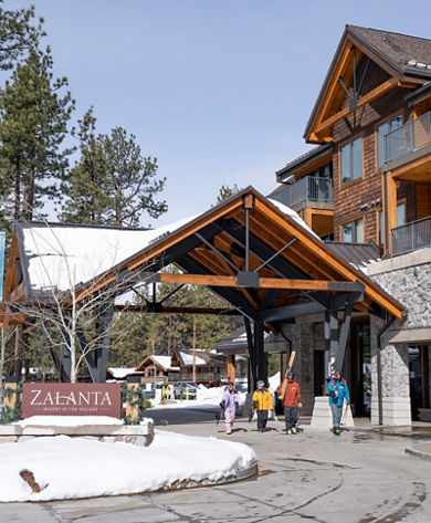 Group of Friends Walking Out of Zalanta Resort with Ski Gear at Heavenly
