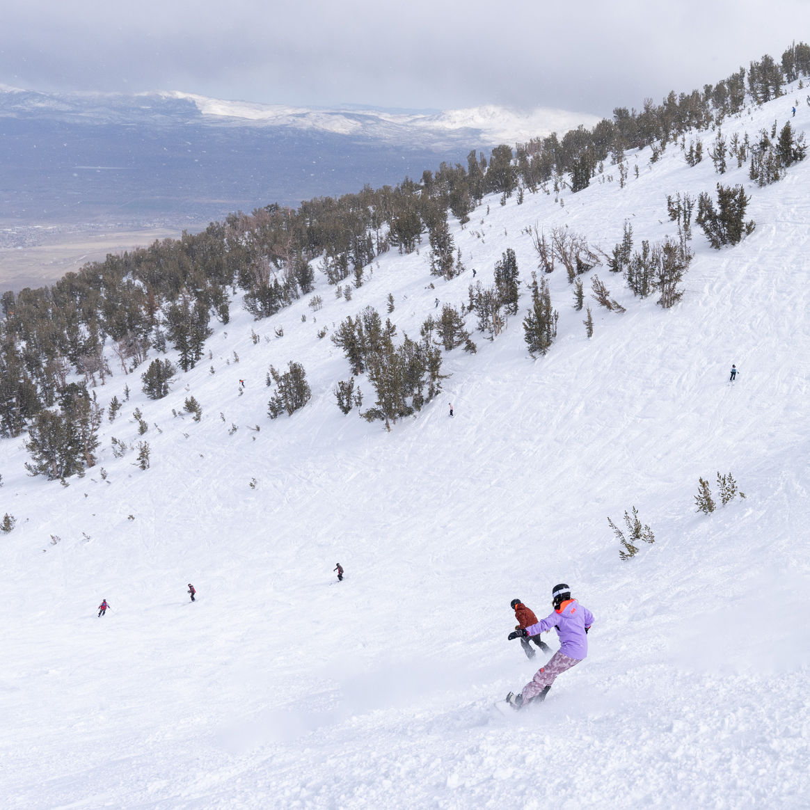 Skiers and Boarder Riding Milky Way Bowl