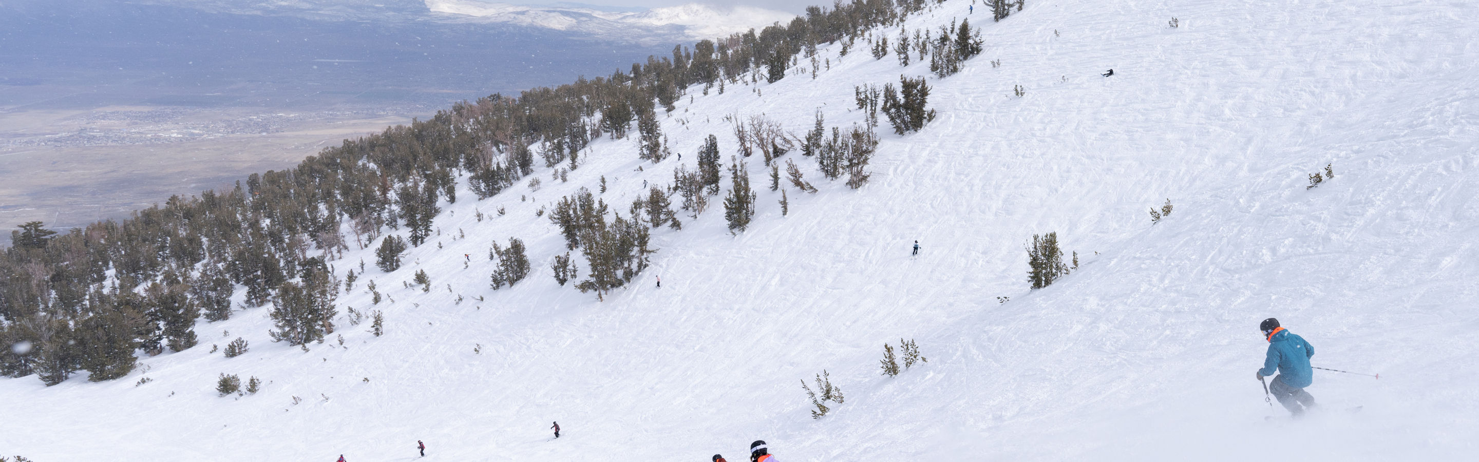 Skiers and Boarder Riding Milky Way Bowl