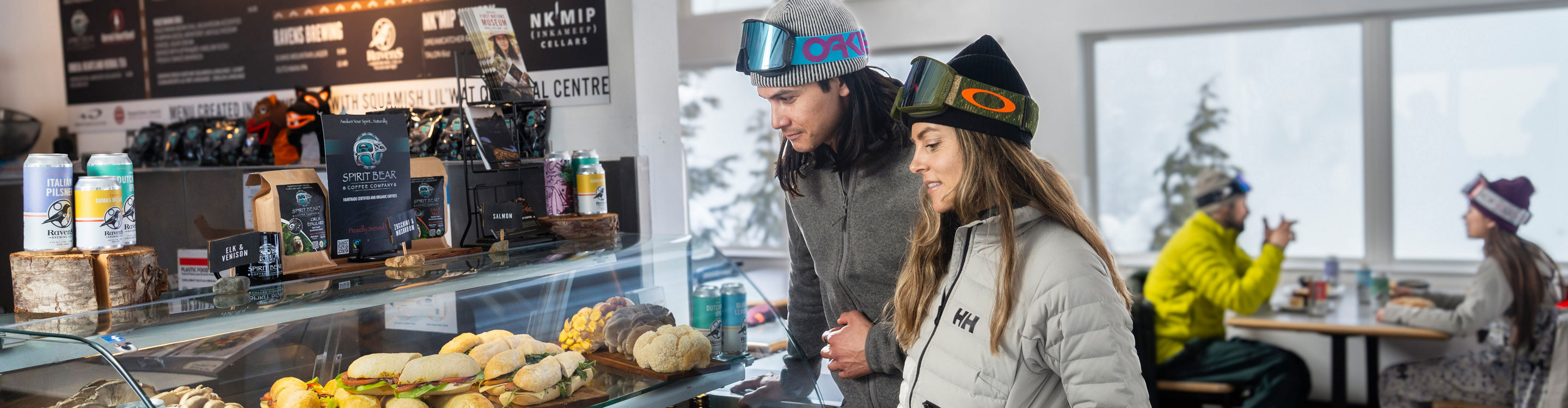 Couple of Friends Look at Grab & Go Lunch Options at Whistler Blackcomb Raven's Nest