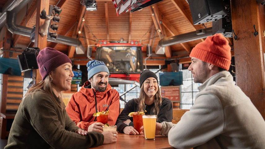 Group of Friends Enjoying Apres at Whistler Blackcomb Merlin's Bar and Grill