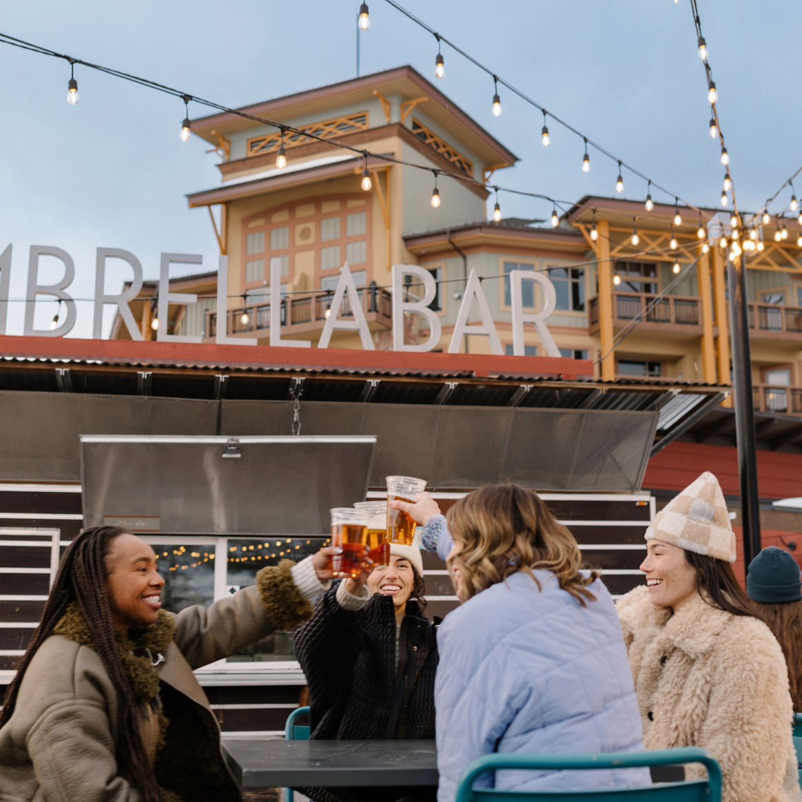 Group of Women Cheers at Park City Umbrella Bar
