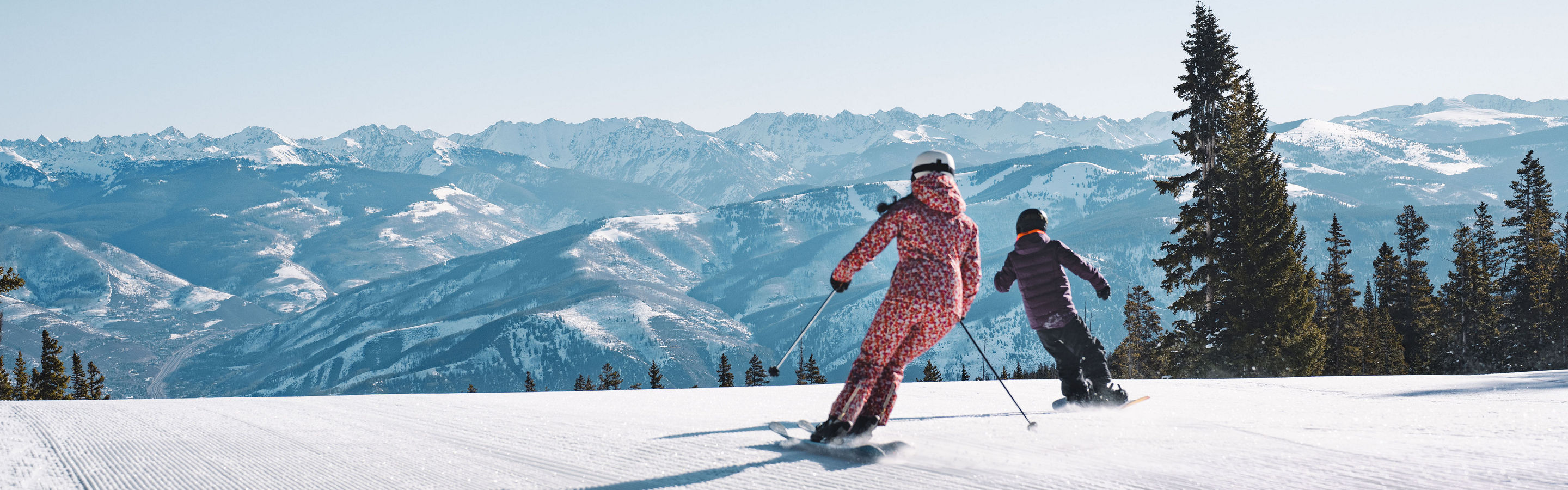 Skier and Young Boarder on Top of Centennial with Gore Range Views?
