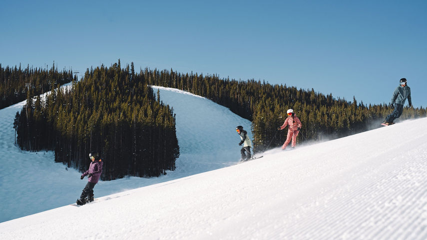 Family of 4 Going Down a Groomed Run in Rose Bowl