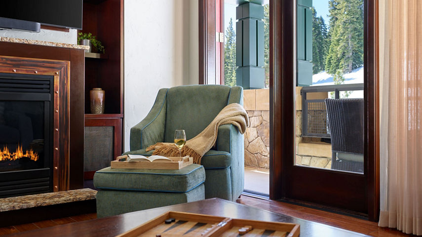 Living Room Still Life of Wine Glass and Book at Constellation Residences at Northstar