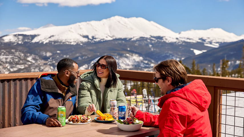 Group of Friends Eat Lunch Outside at Breckenridge Vista Haus