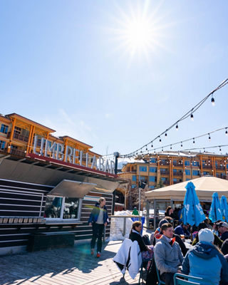 Guests Sit Next to the Umbrella Bar