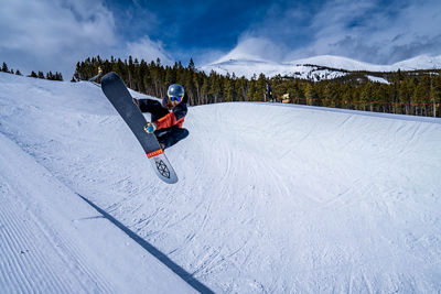 Snowboarder on Half Pipe at Breckenridge Terrain Park