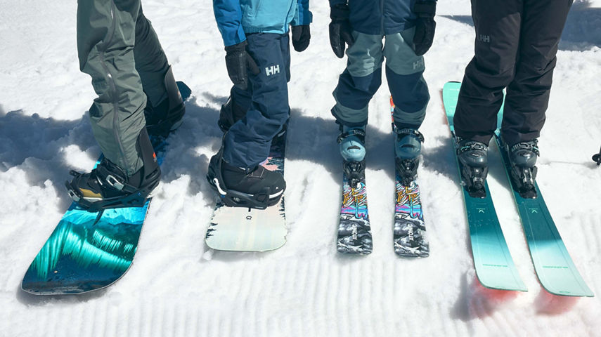 Guests Pose with Ski and Snowboard Gear on Groomed Snow at Beaver Creek