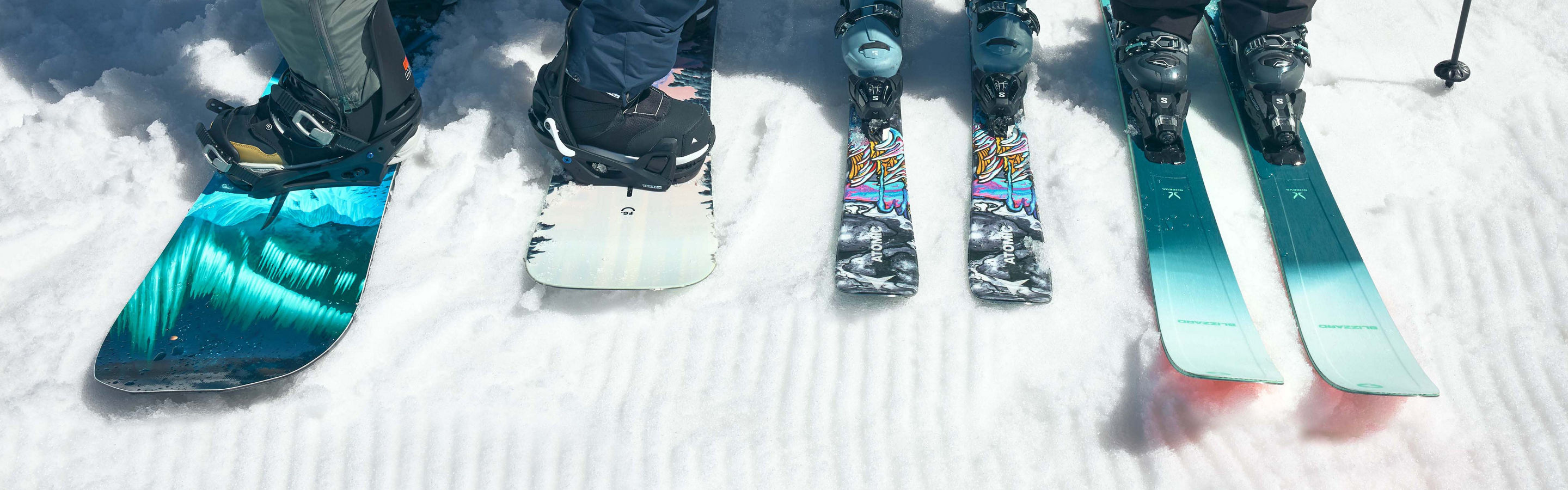 Guests Pose with Ski and Snowboard Gear on Groomed Snow at Beaver Creek