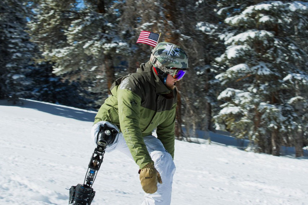 Adaptive Snowboarder in Vail Veterans Program
