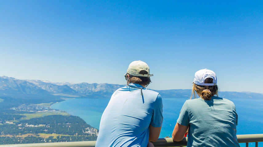 Friends Overlooking Scenic View of Lake Tahoe at Heavenly
