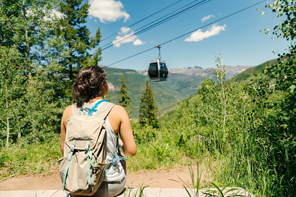 Woman Sitting taking in Scenery after a Summer Hike at Vail