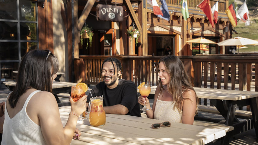 Group of Friends Dining at Dusty's Bar & BBQ at Whistler Blackcomb