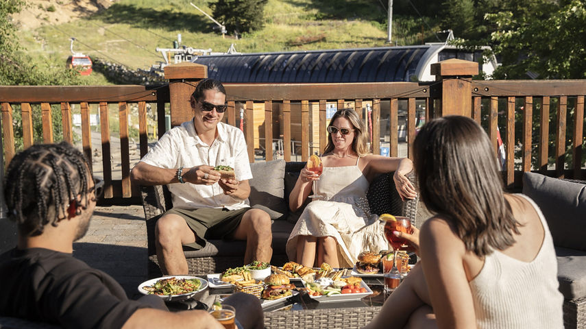 Group of Friends Dining at Dusty's Bar & BBQ at Whistler Blackcomb