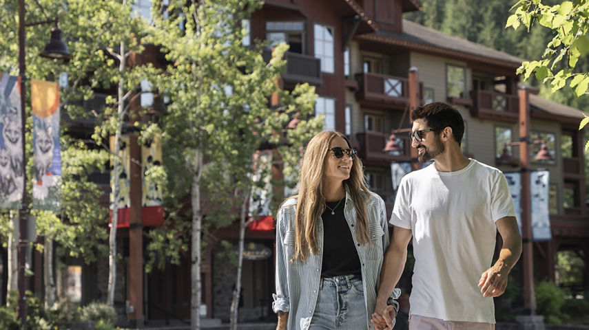 Couple Walks around Whistler Blackcomb Base Area on a Summer Day
