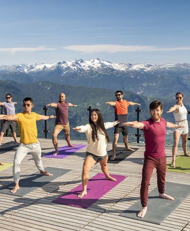 Group of Friends Practicing Yoga at Whistler Blackcomb