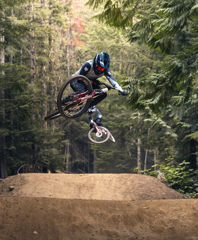 Bikers Riding Over Jumps at Whistler Blackcomb Bike Park