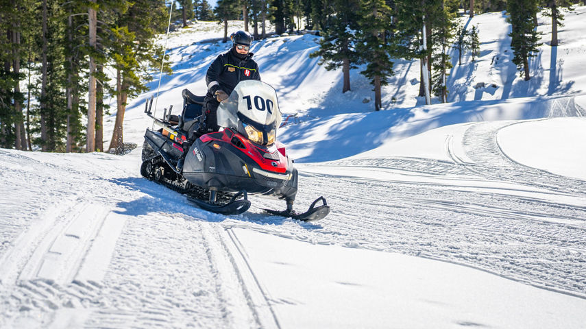 Ski Patroller Riding Snowmobile at Heavenly