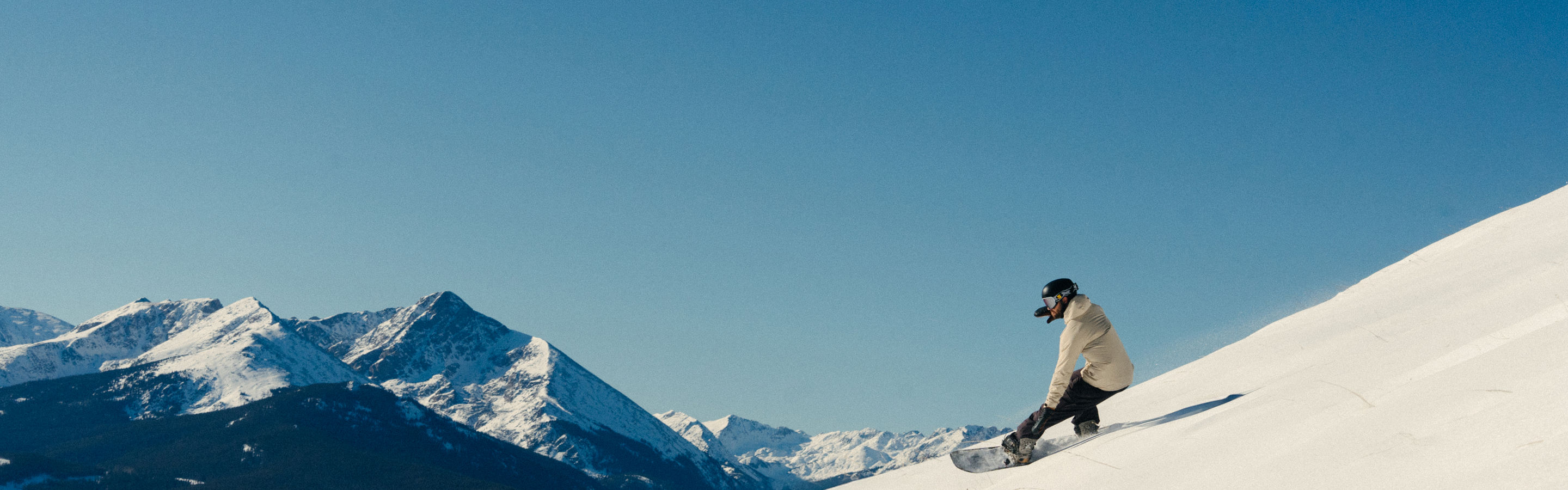 Snowboarder Riding Down Ptarmigan Ridge at Vail