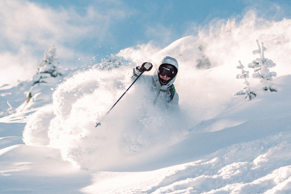Skier in Deep Powder on a Bluebird Day at Vail