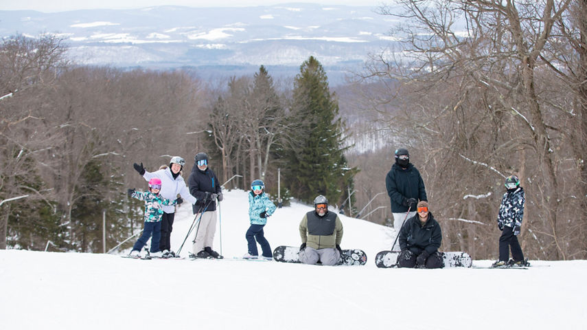 Group with Ski and Snowboard Gear Posing for Camera at Laurel Mountain