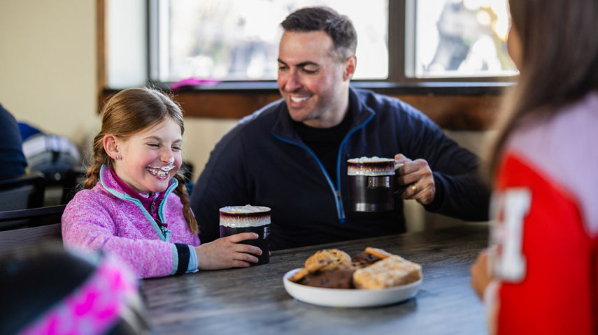 Family Enjoys Hot Cocoa and Sweets During Ski Break at Okemo