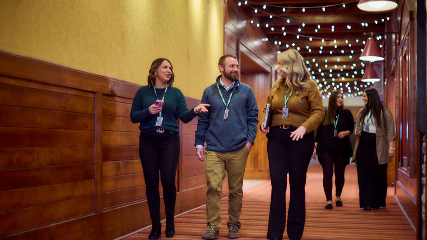 Coworkers Walking Down Hallway at Seven Springs
