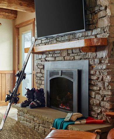 Interior Detail of Ski Gear Gathered around Fireplace at Sevens Springs Birch Chalet