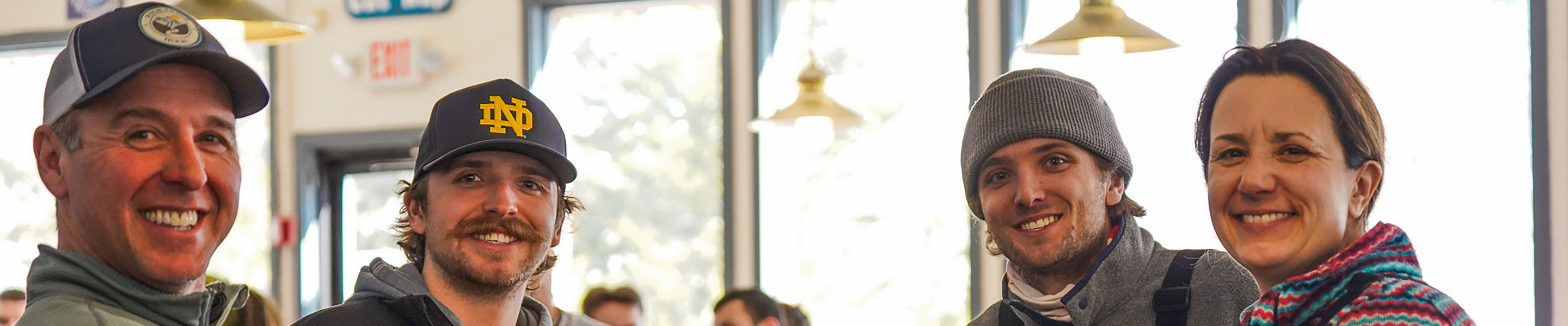 Group of Friends Eating and Drinking at Wildcat Pub